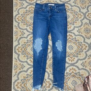 Levi’s 710 super skinny blue distressed jeans